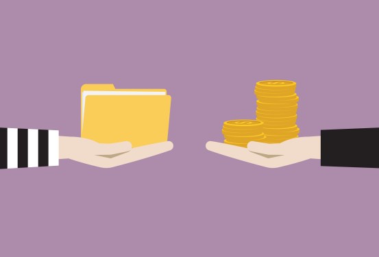 Image of two hands, one holding a pile of coins and one holding files, to represent ransomware.