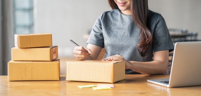 Photo of young business woman working selling online.