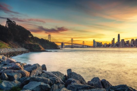 A view of the sun setting behind San Francisco shot from Treasure Island.