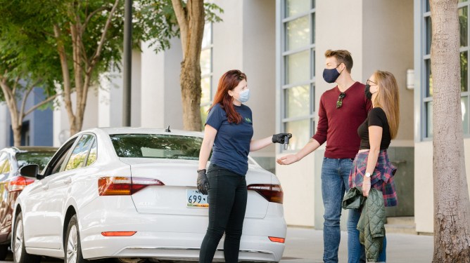 A "kyte surfer" drops off a rental car to kyte customers