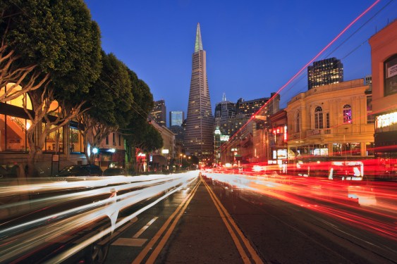 Looking down Columbus Avenue in San Francisco at night toward the Transamerica Pyramid.