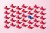 Blue Colored Auto Stamp among Red Rubber Stamps on Pink Background.
