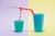 A combination of drinking straws in two cups