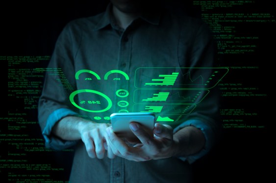 Businessman with a tablet is showing a growing virtual hologram stock and Finance and Investment concept.Money management and Financial chart.