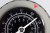 A high-contrast, close up view of pressure gauge dial at 100