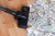 Vacuum cleaner sucks up a pile of US $100 bills