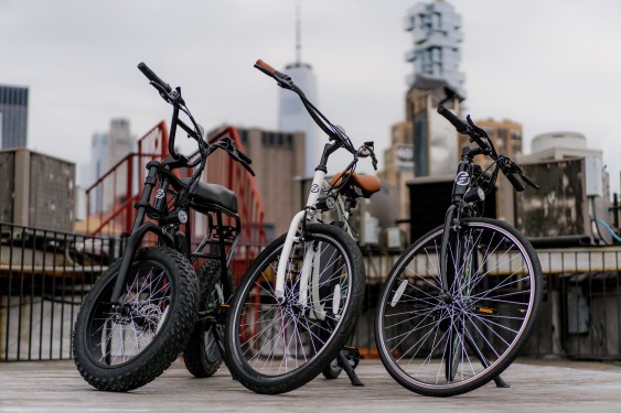 three new Swft e-bikes in front of nyc skyline