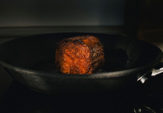 A Juicy Marbles plant-based filet mignon shown being pan-seered