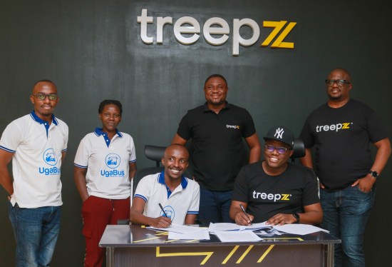 Ronald Hakiza, CEO & Co-Founder of Ugabus with Onyeka Akumah, CEO & Co-Founder, Treepz signing acquisition deal