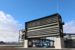 The collectors at the Climeworks Orca plant remove CO2 from ambient air by pumping it through a specially designed filter material. The filter grabs onto the CO2, allowing the rest of the air to pass through. The units are stacked in pairs of two, and each one is about the size of a shipping container.
