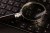 Computer keyboard and magnifying glass, close-up. Computer security concept