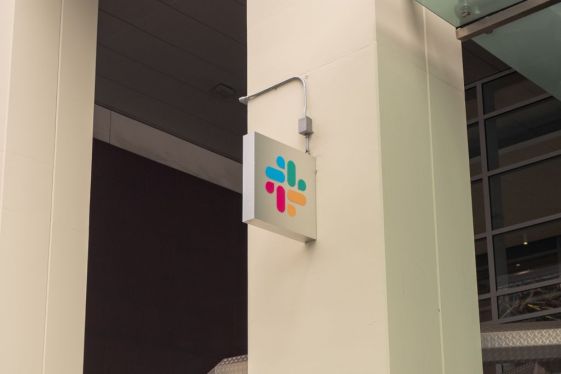 Slack HQ with logo on cement pillar.