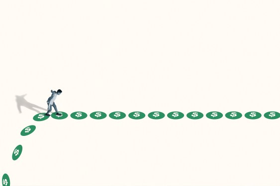 High angle side view of watchful young man walking on green dollar signs against white background