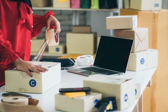 E-commerce seller preparing a package, used in a story about Una Brands