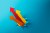 A group of arrow head moving upwards, breaking through coloured background.