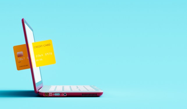 Online shopping concept. Credit card and laptop computer on blue background 3D Rendering, 3D Illustration