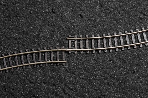 two pieces of model railroad track that have been improperly joined