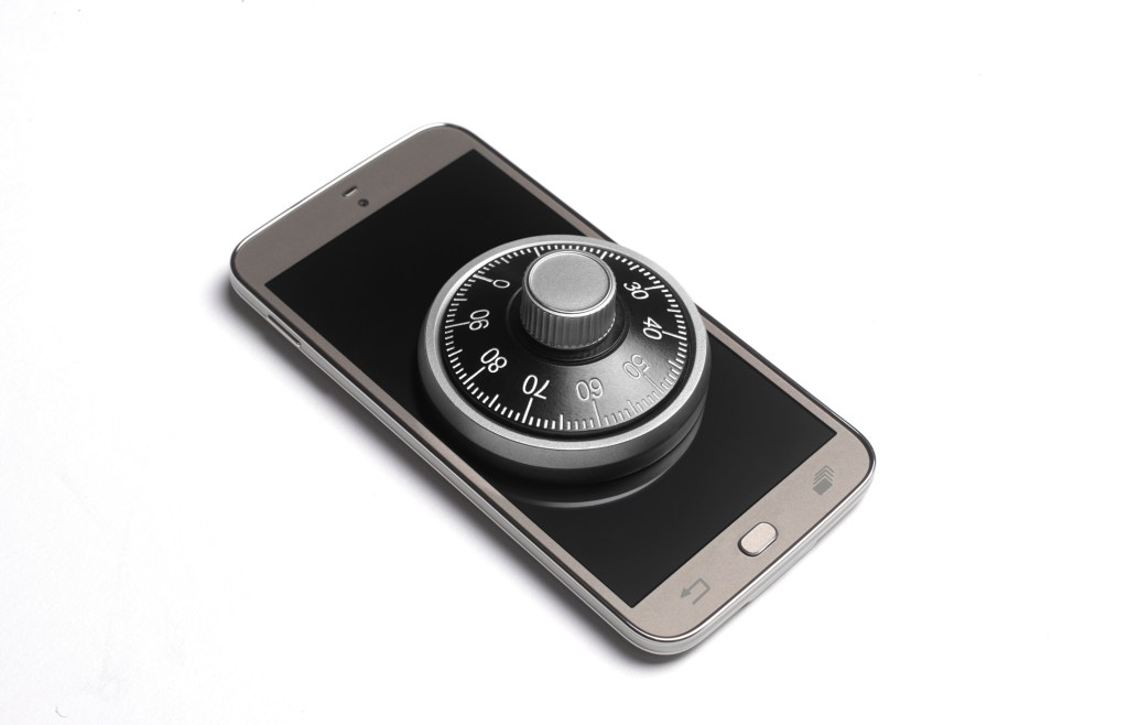 Photo of smartphone with a combination lock on it, used in article about First AML