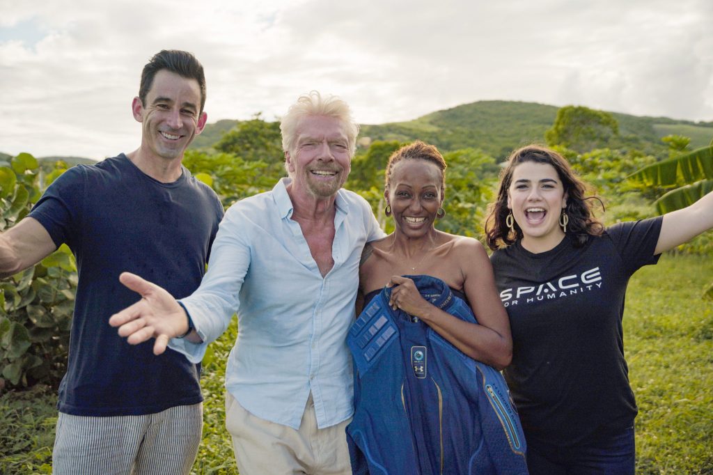Keisha, third from left, is congratulated by others from Virgin Galactic, Omaze, and Space for Humanity.