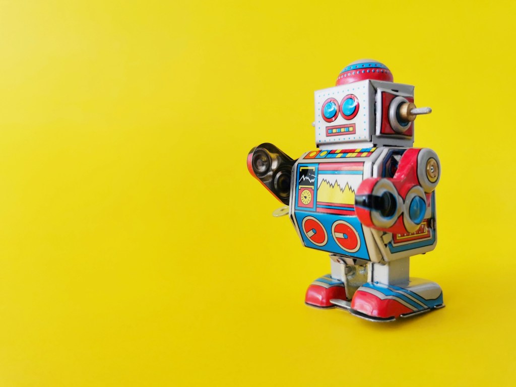 Close​ up​ robot on a yellow background