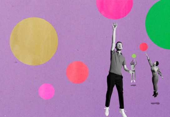three people jumping for bubbles