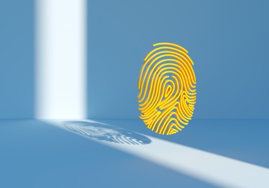 Image of a digitally generated yellow fingerprint spotlighted on blue background.