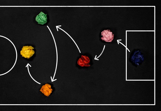 Football play strategy drawn out on a chalk board