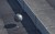 man watching wrecking ball swinging at wall