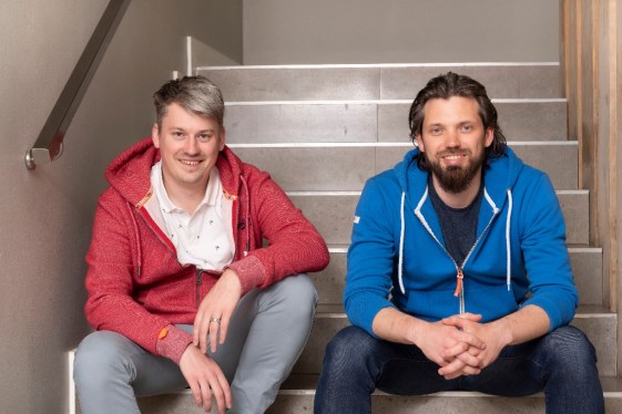 Planet42 founders seated on staircase