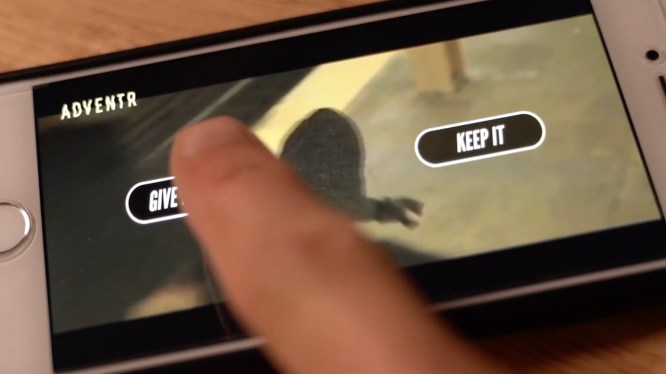a finger hovers over an iphone with a video on it, waiting to tap one of two choices -- "give it back" or "keep it"
