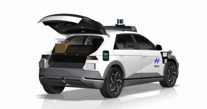 An autonomous hyundai ioniq 5 branded by uber and motional