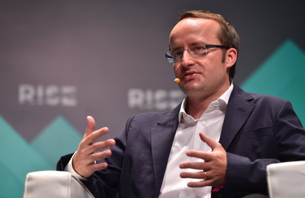 Kris Marszalek, co-founder & CEO of CRYPTO.com, seated onstage at MoneyConf.