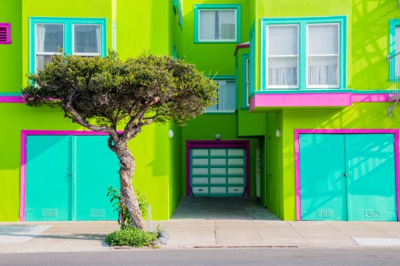 A house in bright green and blue colors near Ocean Beach in San Francisco, CA.