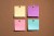 Multi Colored Note Paper on Cork Board