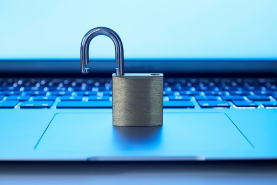 An open padlock on a laptop's touchpad