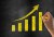 Hand drawn graph on blackboard illustrating slow but steady growth