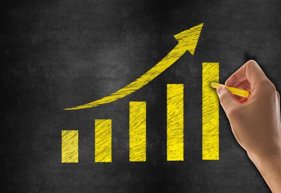Hand drawn graph on blackboard illustrating slow but steady growth