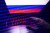 Russian flag displayed on a laptop screen and binary code code displayed on a screen are seen in this multiple exposure illustration photo