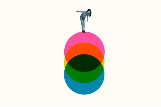 Young woman standing on colorful circles against white background