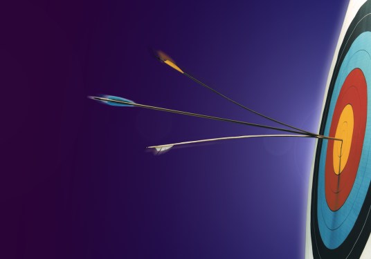 An arrow hitting the bullseye, slicing the earlier arrow in the centre.