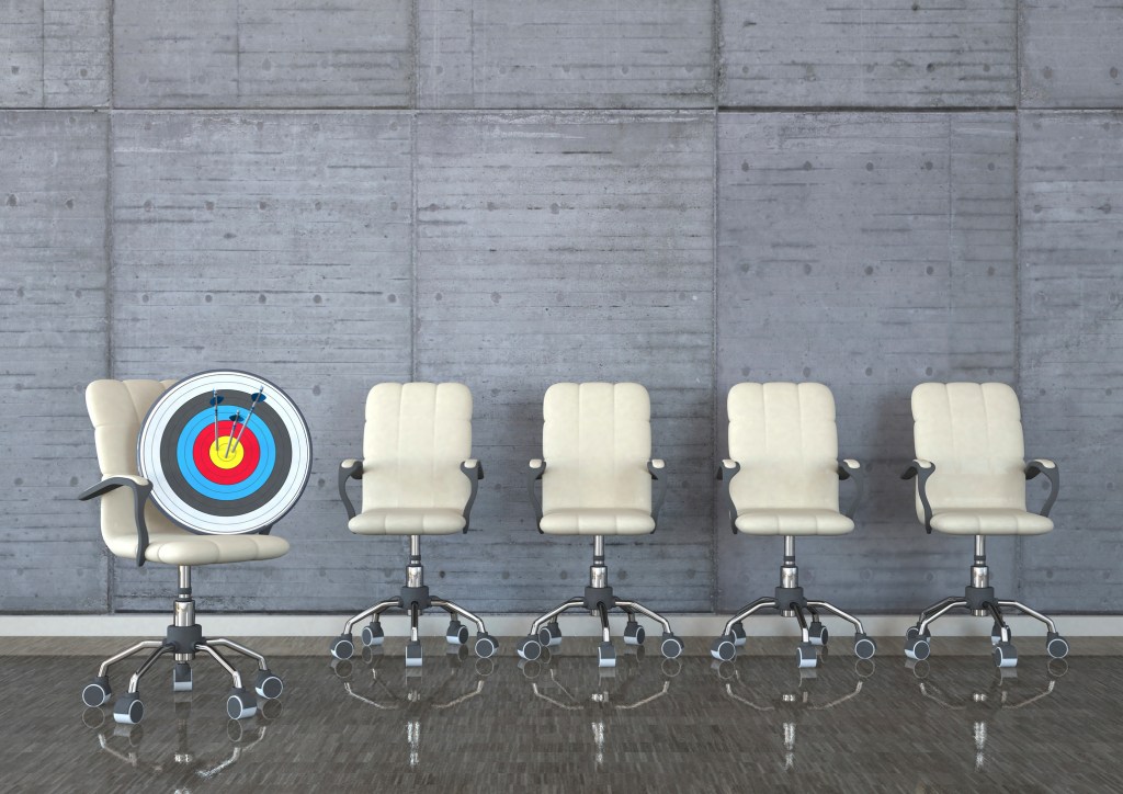 chairs with target and arrows in a room