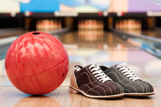 Bowling shoes and ball on the lane