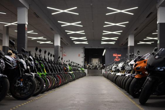 Row of used motorcycles at Mundimoto Headquarters Barcelona