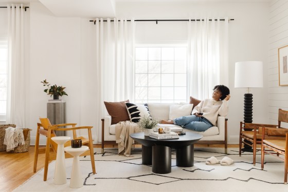 woman on couch in well-appointed living room