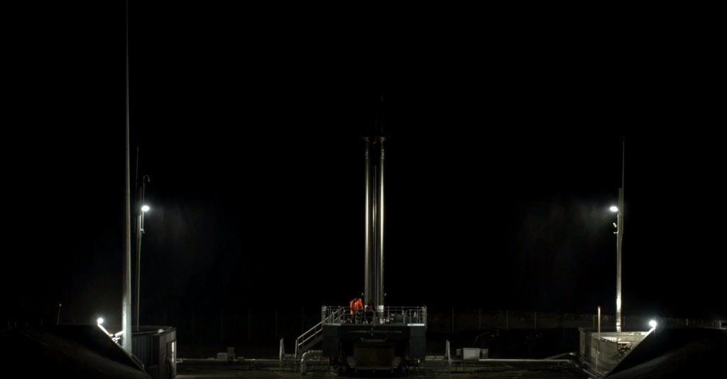Image of Rocket Lab rocket waiting to launch at night from New Zealand.
