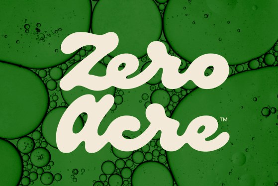 Composite image of Zero Acre's logo over a close-up of oil droplets.