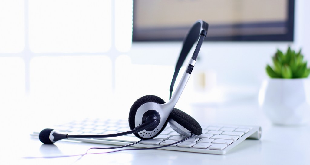 VOIP headset on laptop computer keyboard.