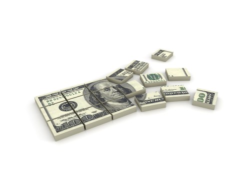 Stack of $100 bills broken in squares