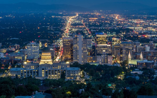 The skyline at night of a U.S. state capital.