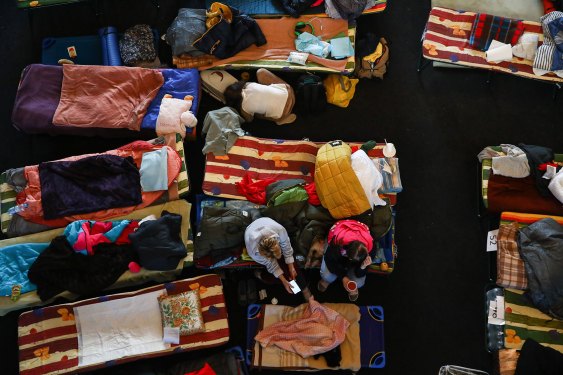 Refugees from Ukraine who arrived to Krakow due to ongoing Russian attacks on Ukraine are seen at a temporary shelter inside the reception point organized in a former historic building of railway station in Krakow, Poland on March 11, 2022